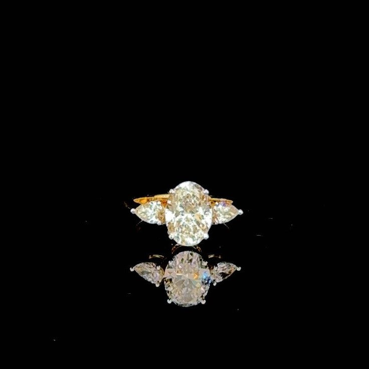 Stunning Oval Shape Lab Grown Diamond Ring with Pear Shape Side Diamonds